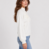 Crane | Pull avec fleur en relief