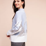 Wells | Pull imprimé paysage hivernal