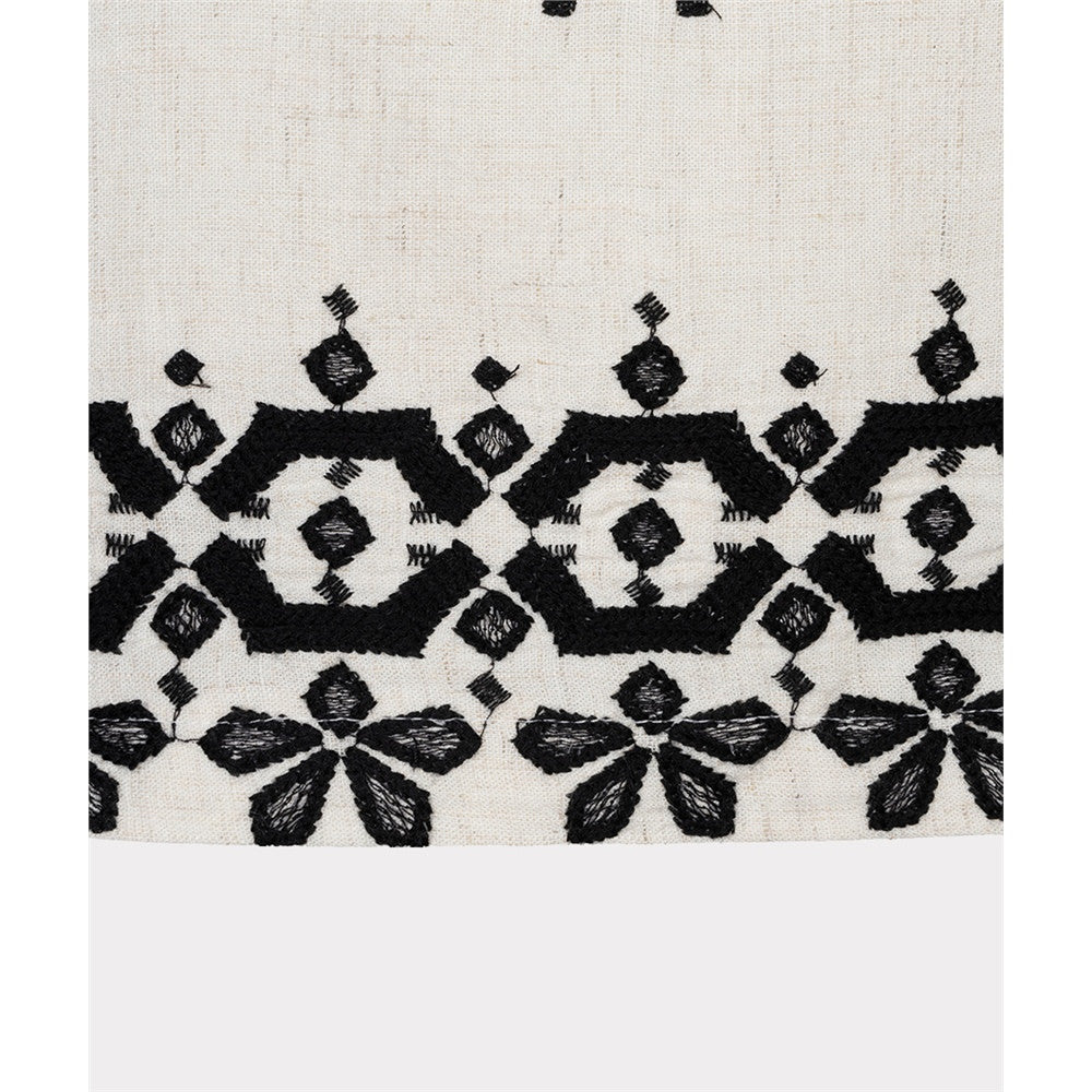 Blouse sans manches broderie contrastante