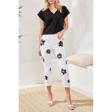 Pantalon étroit avec imprimé fleur - Taille : 4 - Couleur : Blanc/Noir